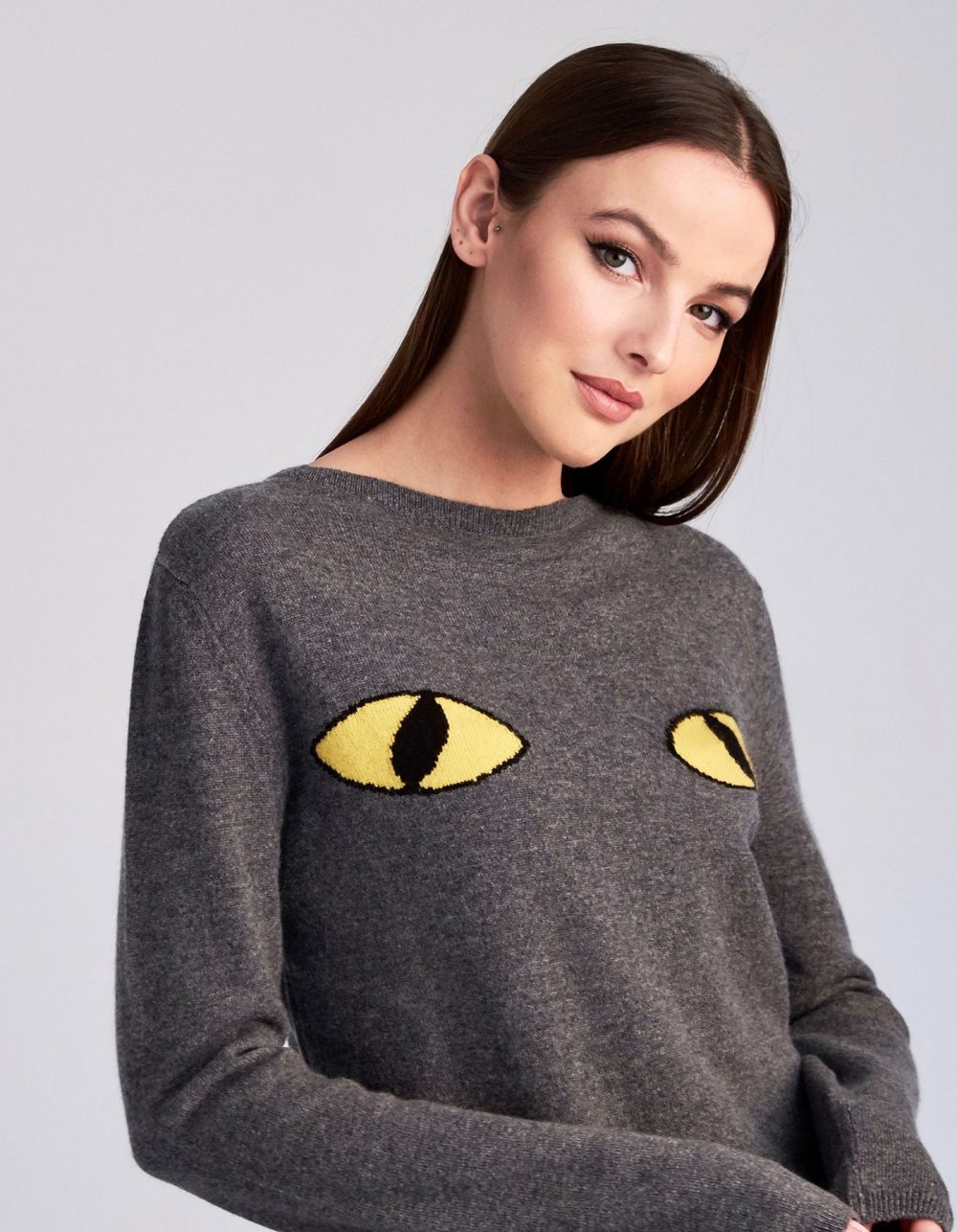 A woman modelling Cat Eyes womens cashmere jumpers, part of the designer cashmere knitwear collection at malin darlin.