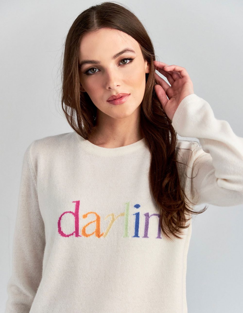 A model wearing darlin pastel cashmere knitwear, one of the signature styles in malin darlin womens jumpers.