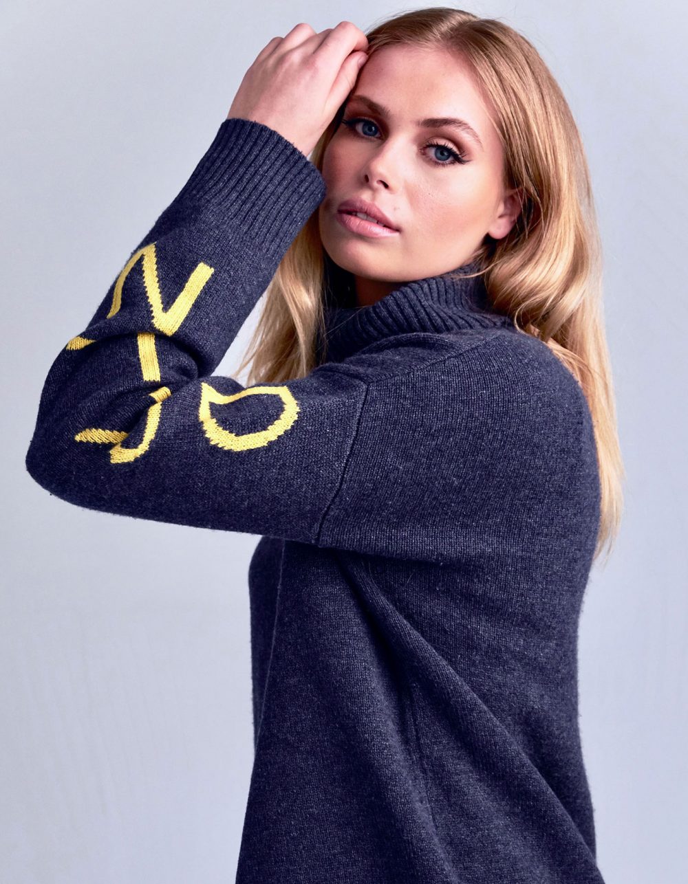 Promotional photo for malin darlin womens jumpers, a model wearing the signature DRLN oversized cashmere jumper.