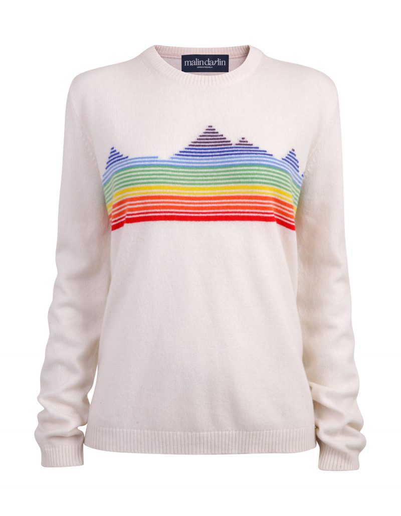 Malin darlin and lady kilas charities Rainbow Mountain designer cashmere jumper laid flat on a white background.