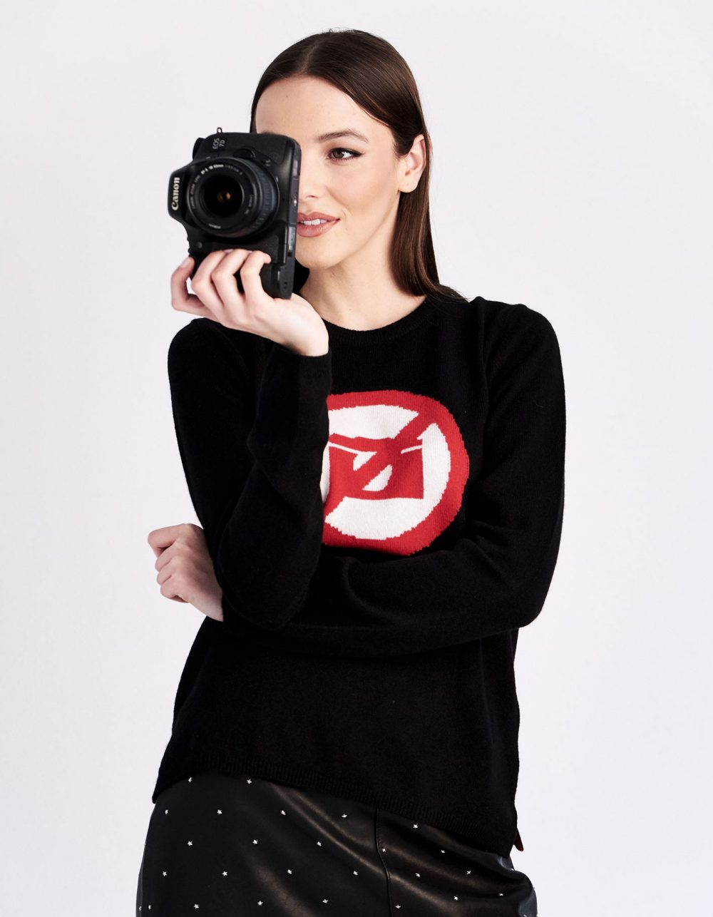 Camera photograph design on black cashmere jumpers.