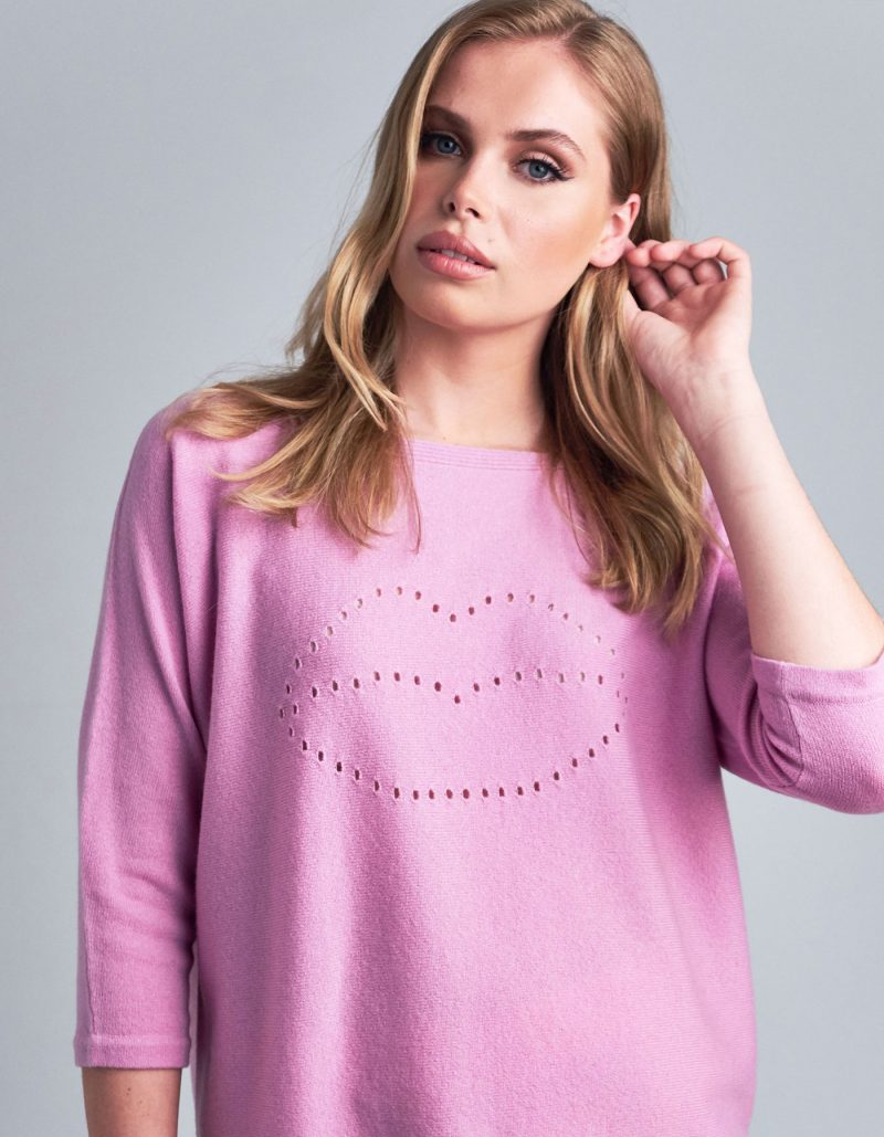 A studio picture of cashmere knitwear, showing malin darlin Lip Holes cashmere jumpers.